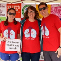 surrogate and intended parents at a fundraiser for cystic fibrosis